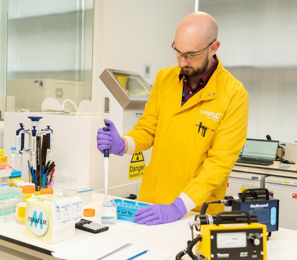 Radiochemsitry scientist working in a lab on precision cancer therapies
