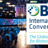 A graphic composition showing event attendees at a venue as the background image with a logo for BIO International Convention over the top.