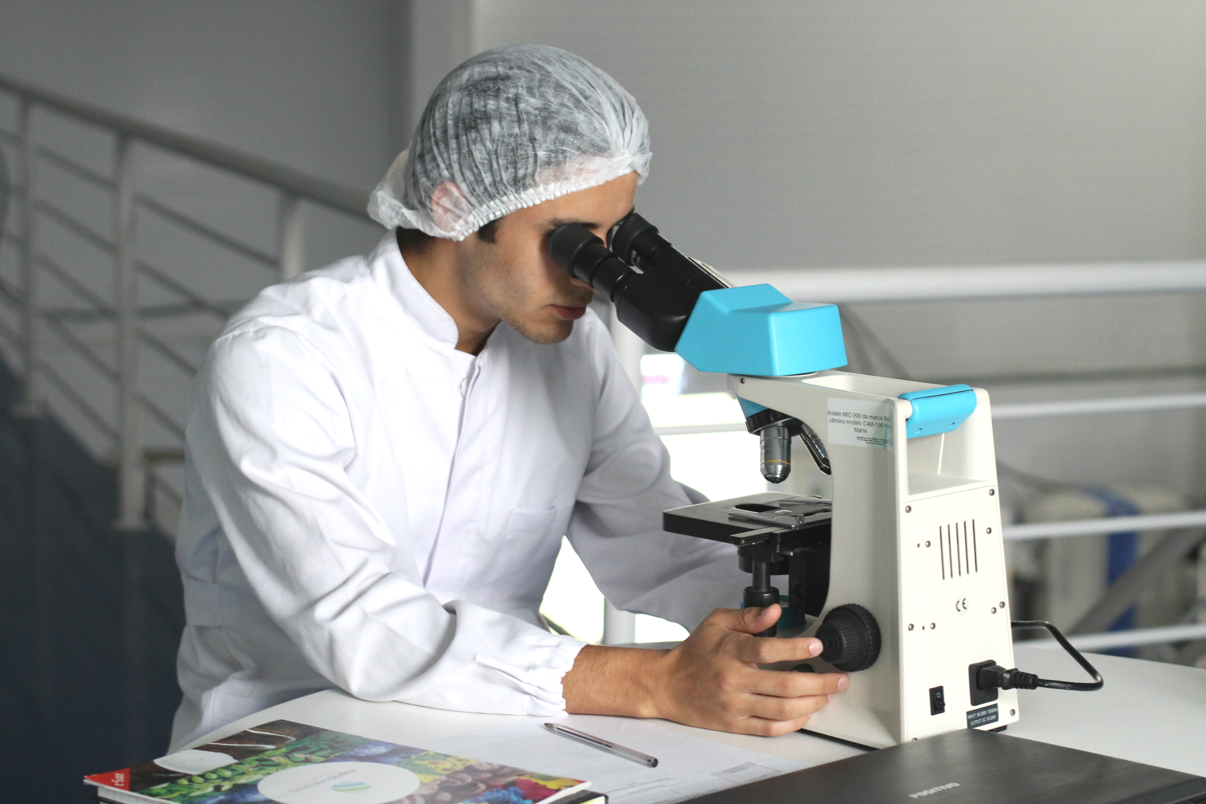 Photo of a technician using microscope