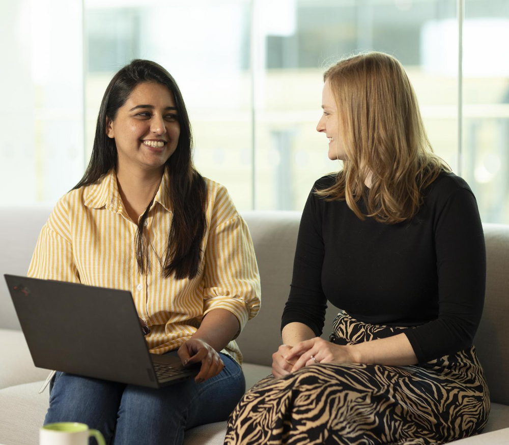 A set of colleagues having a conversation in an office for the health startups blog.